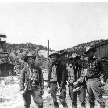 Miners stand in front of Kelly Mine